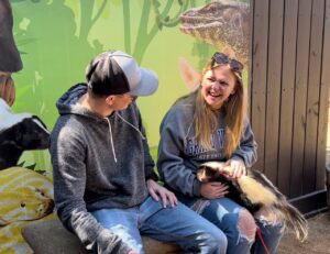 A private animal encounter with a striped skunk animal ambassador.