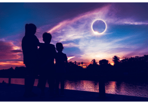 a family witnesses the awe-inspiring solar eclipse, with solar glasses!