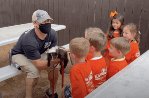 A field trip animal encounter with Pepe the striped skunk